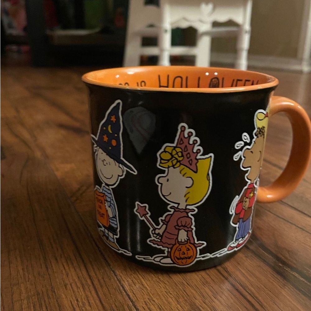 peanuts all the characters happiness is halloween mug